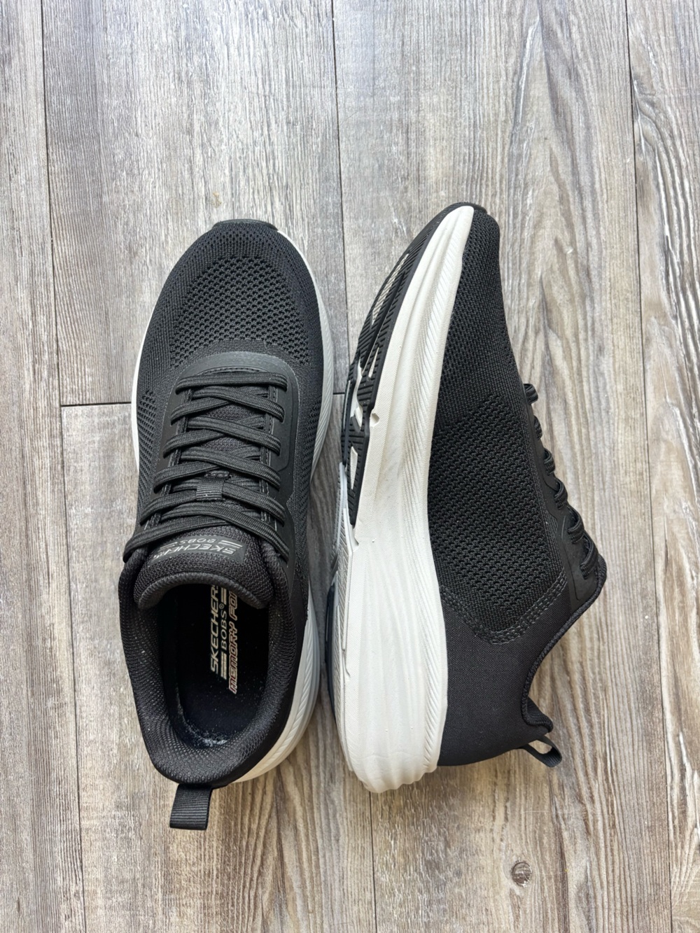 Skechers woman’s Black and White Athletic Running Shoes